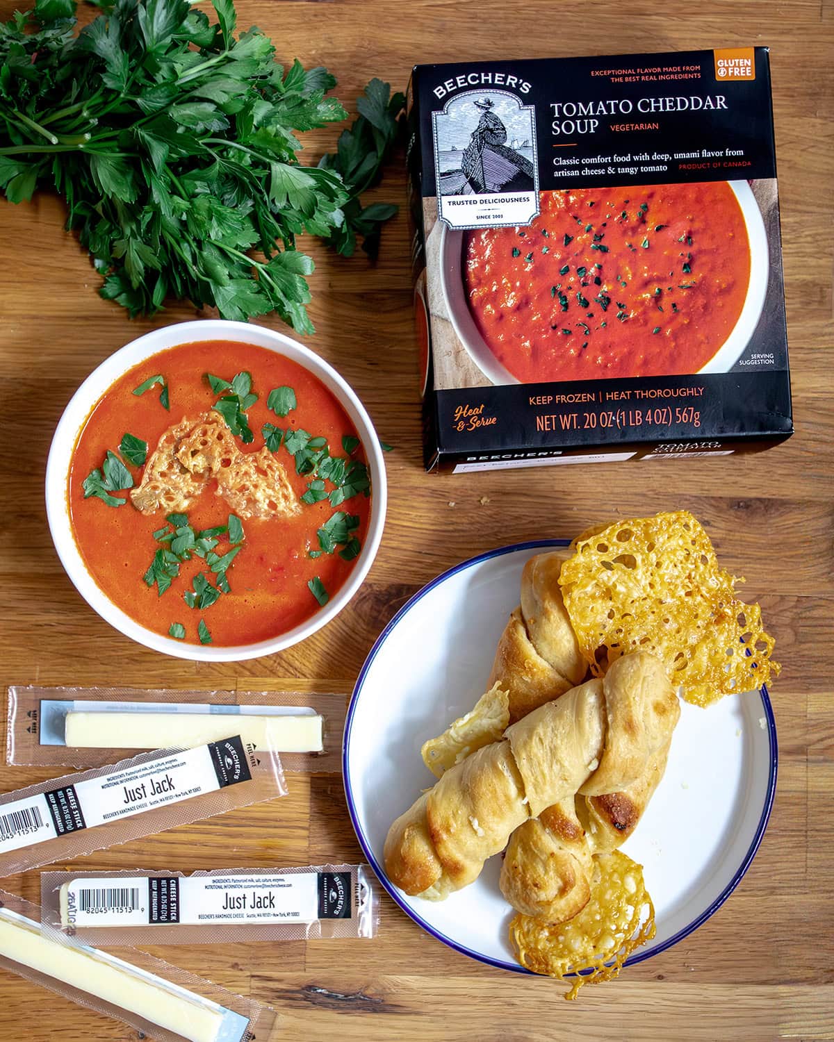 Just Jack cheese-stuffed breadsticks on plate with cheese sticks and tomato soup