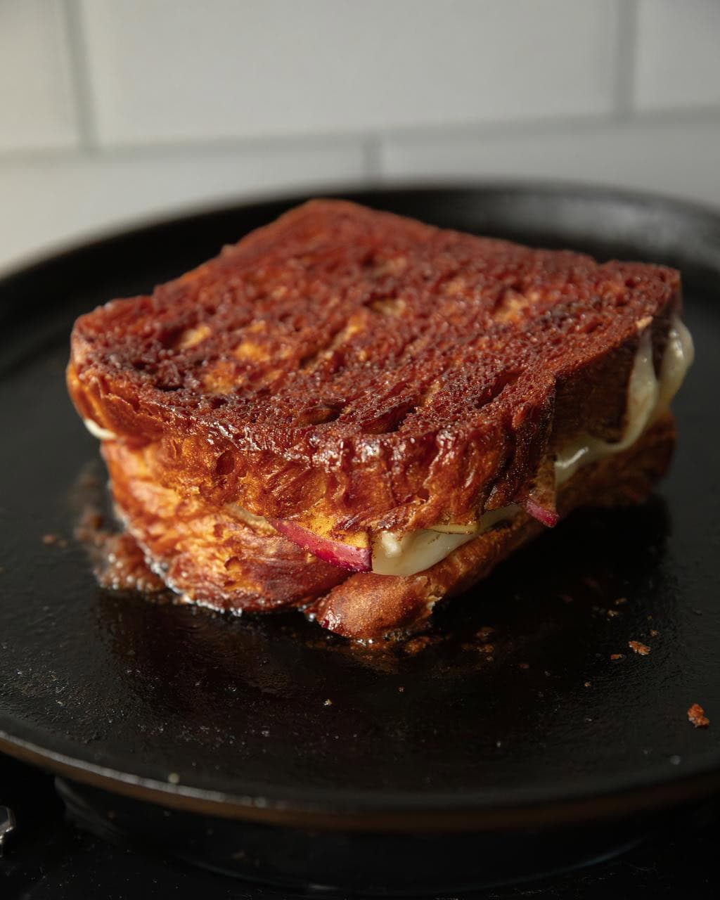grilled cheese in pan being cooked