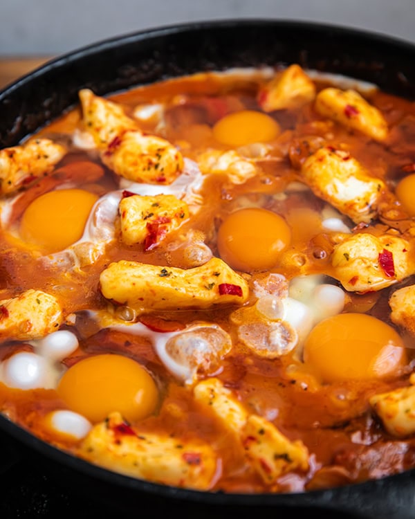 Tomato Cheddar Harissa Skillet Eggs