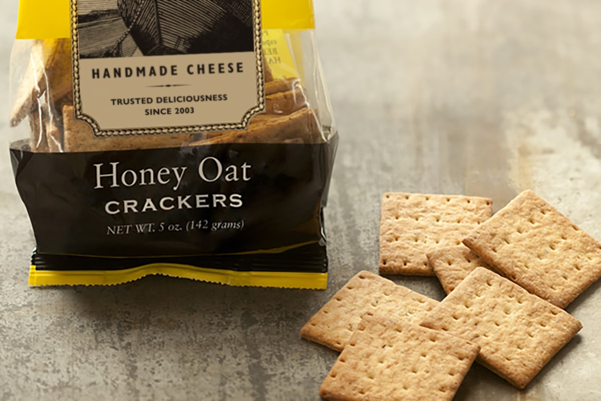 Honey Oat Crackers beauty shot with packaging